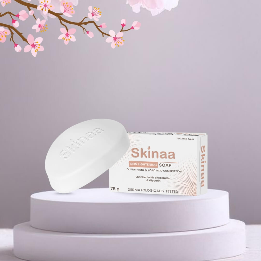 Skinaa Skin Lightening Soap with Glutathione, Kojic Acid, and Botanical Extracts, displayed with a floral background. Dermatologically tested formula that brightens skin, reduces dark spots, and promotes an even skin tone.